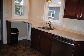 Custom Kitchen with Avonite Countertops, Armstrong Cabinets, and Armstrong Linoleum Flooring